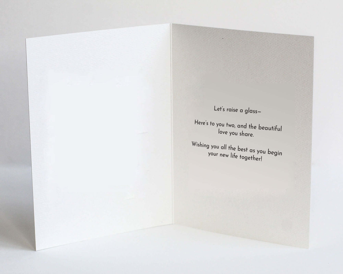 inside of jumped the broom wedding card that has celebratory text