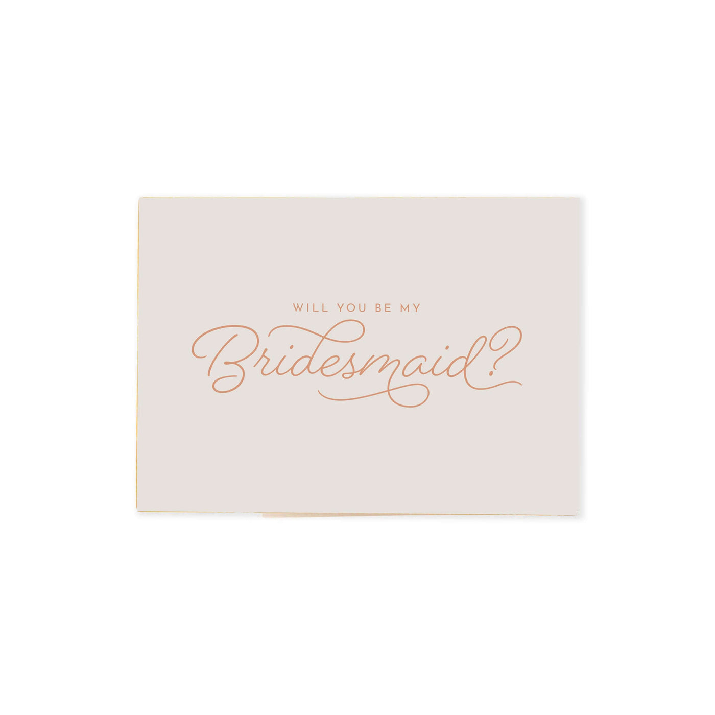 cream colored Be my bridesmaid proposal card that reads "will you be my bridesmaid?" in neutral orange cursive font.