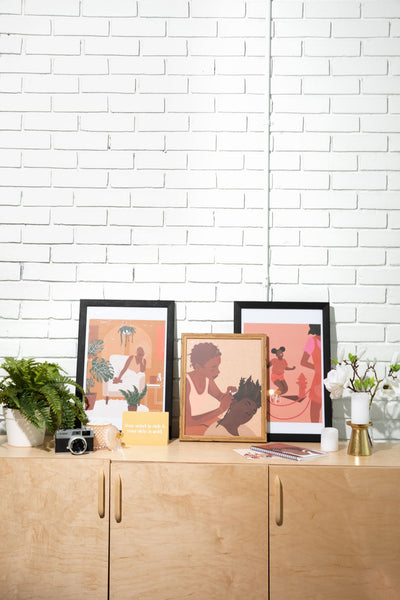 view of wall art in frame surrounded by other pictures for reference