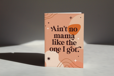 orange cream colored Mama greeting card that reads "Aint no mama like the one i got" on the cover