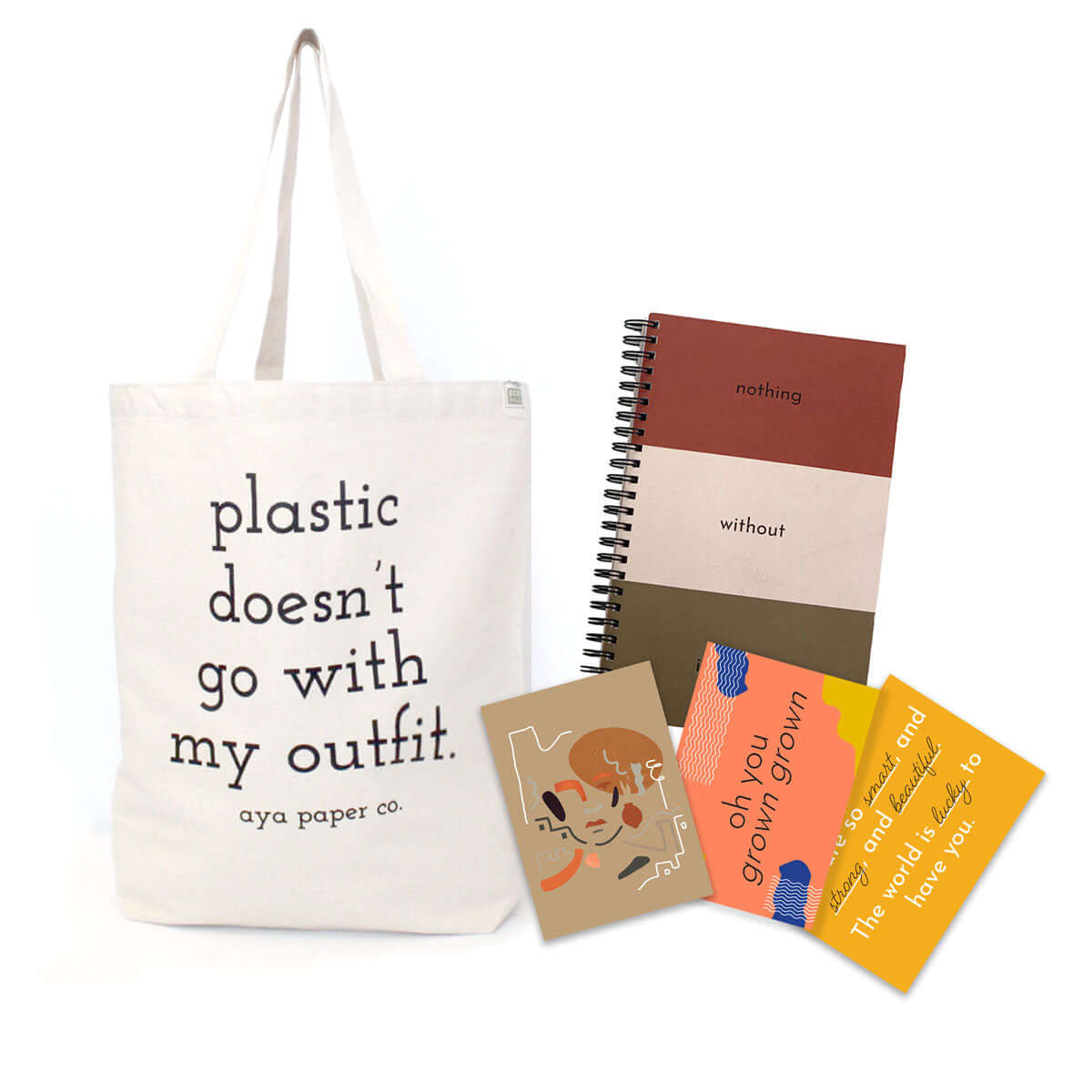 plastic doesnt go with my outfit tote bag with intention journal, affirmation card, abstract illustration card, and grown grown birthday card