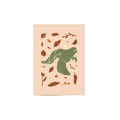 tan colored Capricorn greeting card with a neutral green Capricorn illustration.