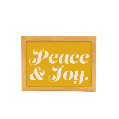 horizontal yellow card with large white text that reads peach and joy