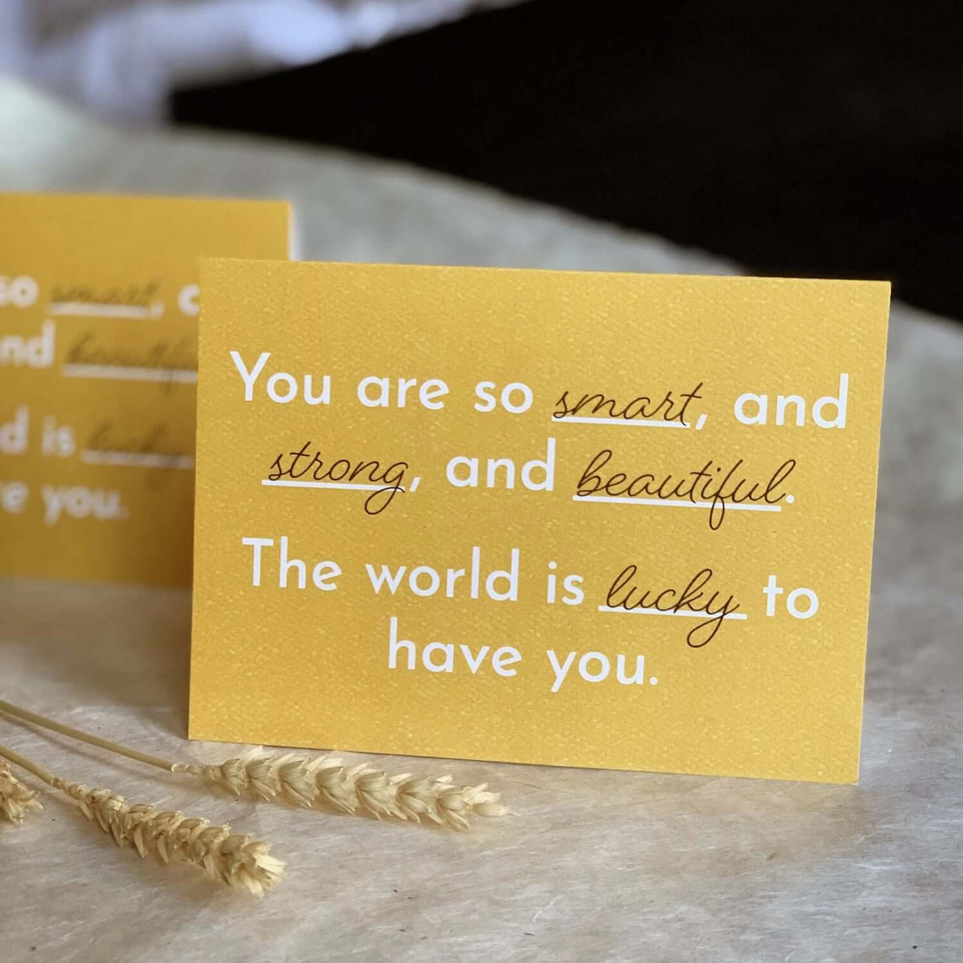 Yellow Greeting Card says "You are so smart, and strong, and beautiful. The world is lucky to have you"