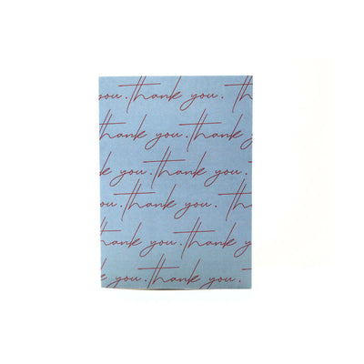blue card that reads "thank you" in pink cursive writing multiple times on the cover