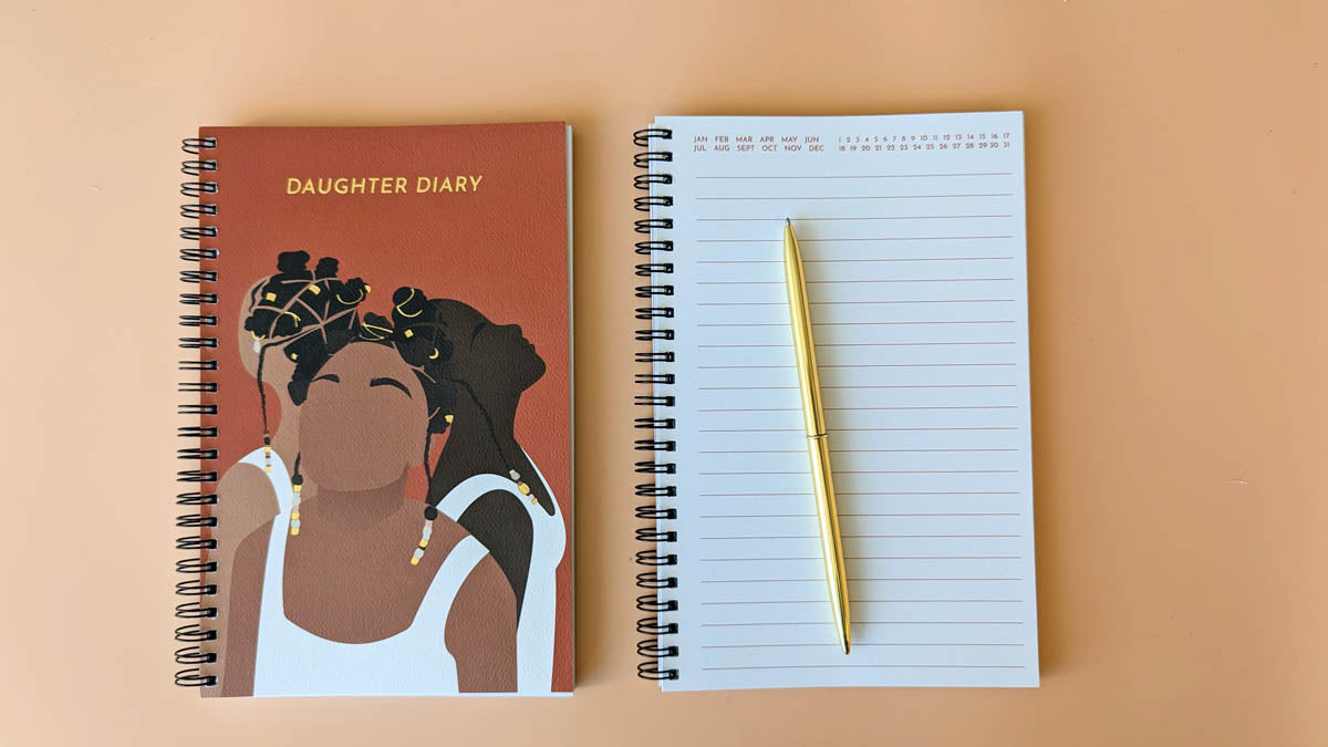 Daughter diary cover with an illustration of three black women back to back looking up as well as inside of diary showing empty pages.