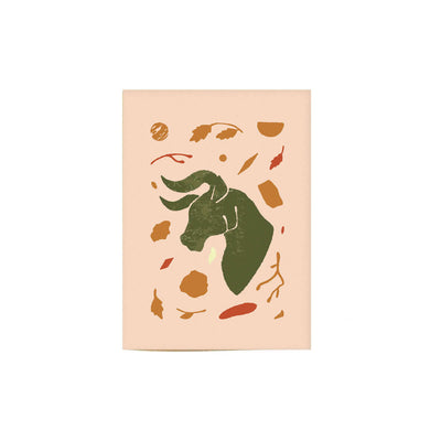 tan colored Taurus greeting card with green taurus illustration on cover of card.