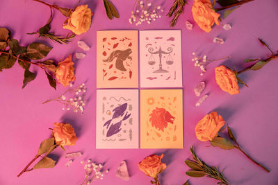 set of four astrology greeting cards including leo, aries, pisces, and libra