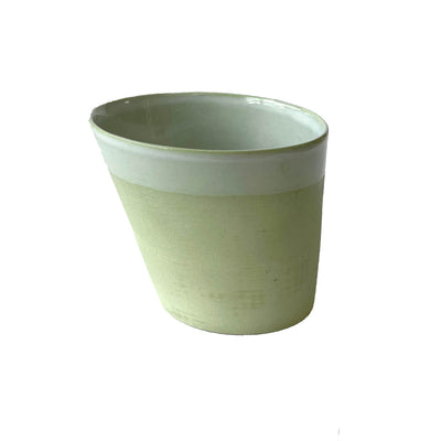 sleek and simple sage colored local cup with slanted profile and smooth finish 