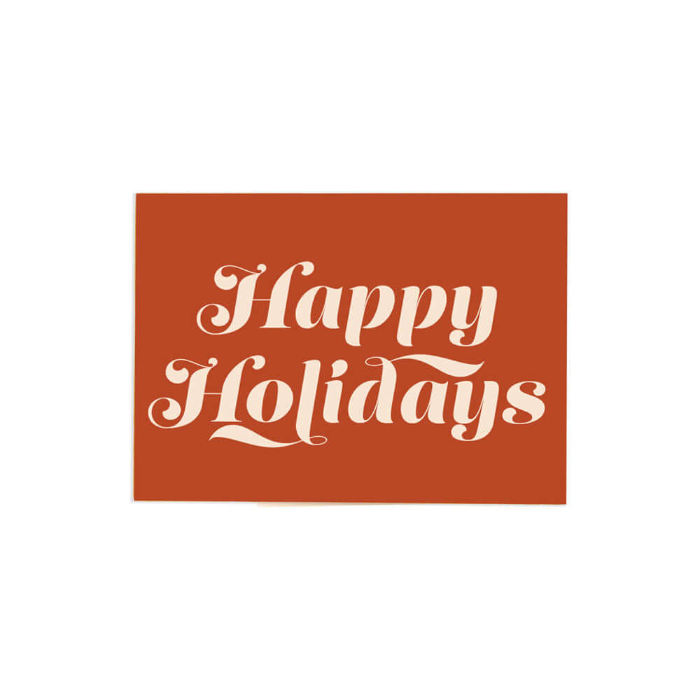 horizontal orange happy holidays card that reads "happy holidays" in white bold fancy font