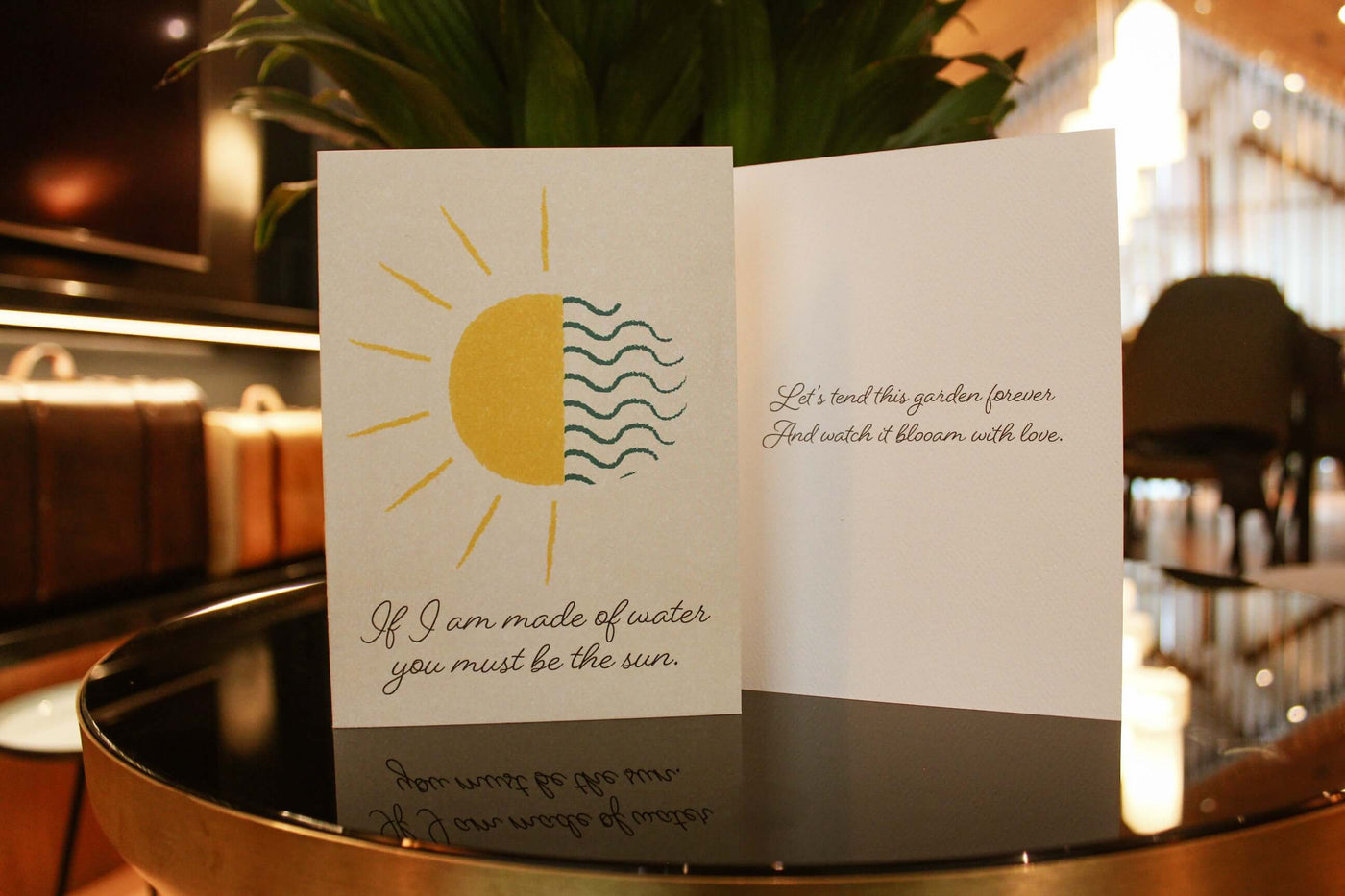 cover of water and sun card as well as the inside that reads "lets tend this garden forever, and watch it bloom with love"