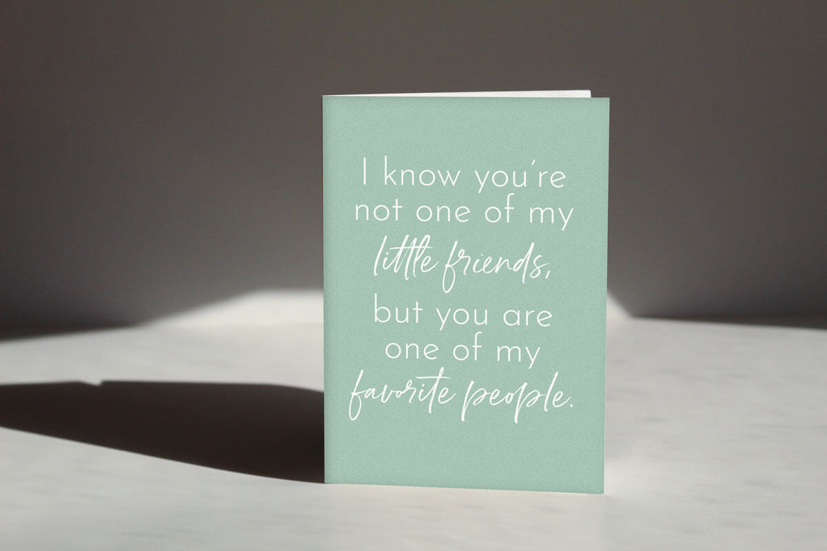 Sage colored "Not your little friend card" that reads "I know you're not one of my little friends, but you are one of my favorite people" in delicate white text