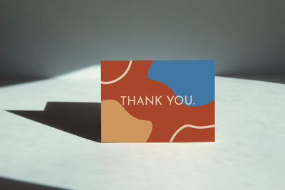  "Retro Thank You Card" with an orange, blue, and yellow abstract illustration that reads "Thank You" in white text and simple font